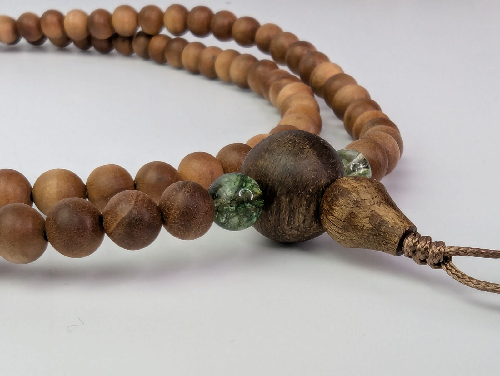 Custom-made 108 sandalwood mala with gemstone