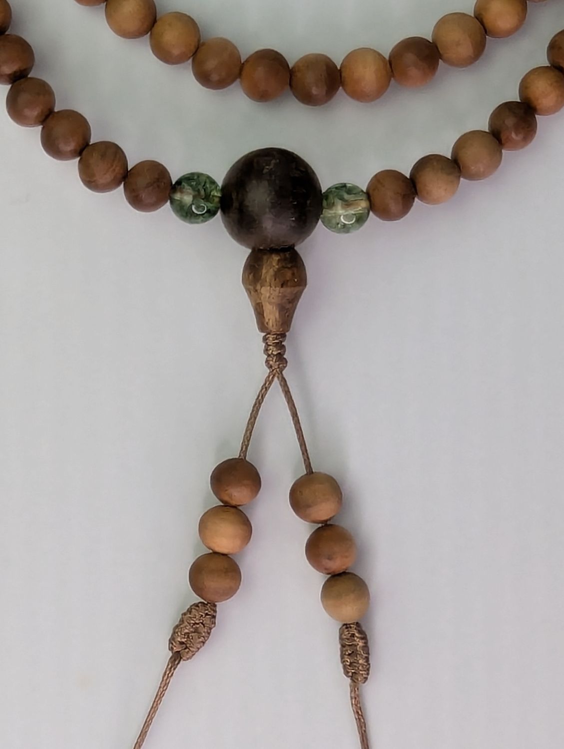 Custom-made 108 sandalwood mala with gemstone