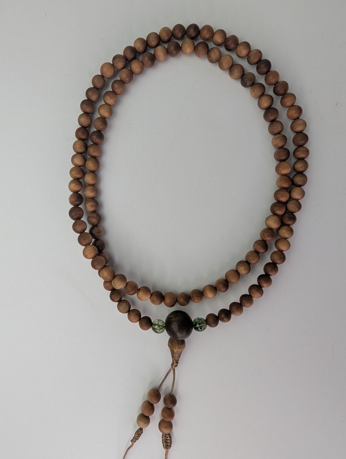Custom-made 108 sandalwood mala with gemstone