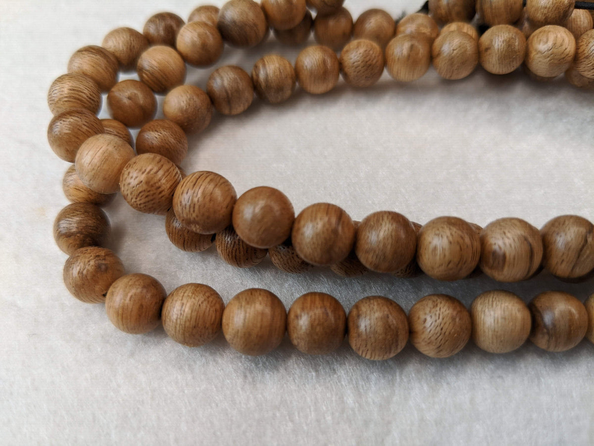 SOLD- 12.5 g, 8mm, Wild Borneo Agarwood 108 mala with a large piece of remaining material -