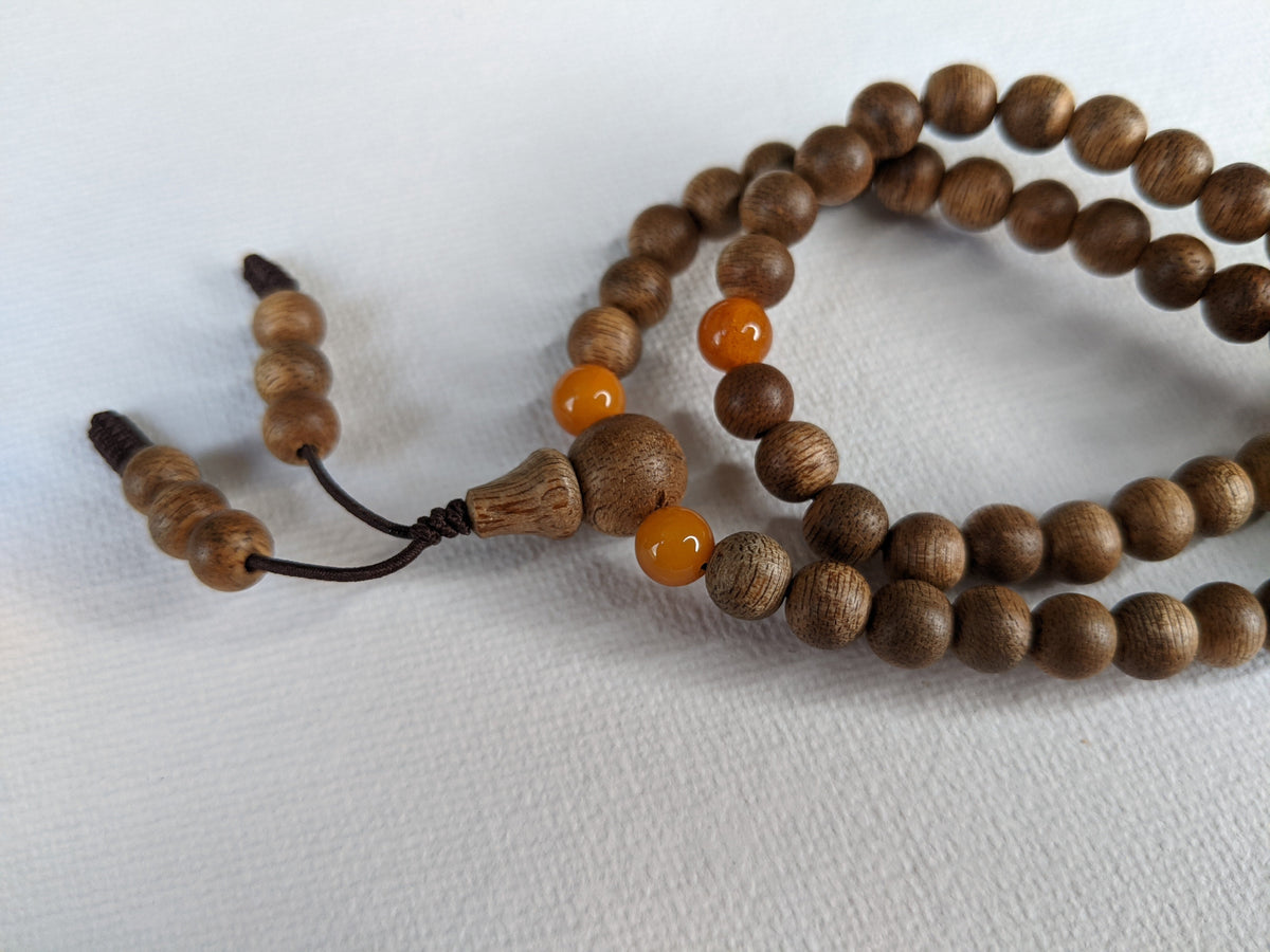 The Mood Improver - 108 Cultivated Agarwood mala with Baltic Ambers -