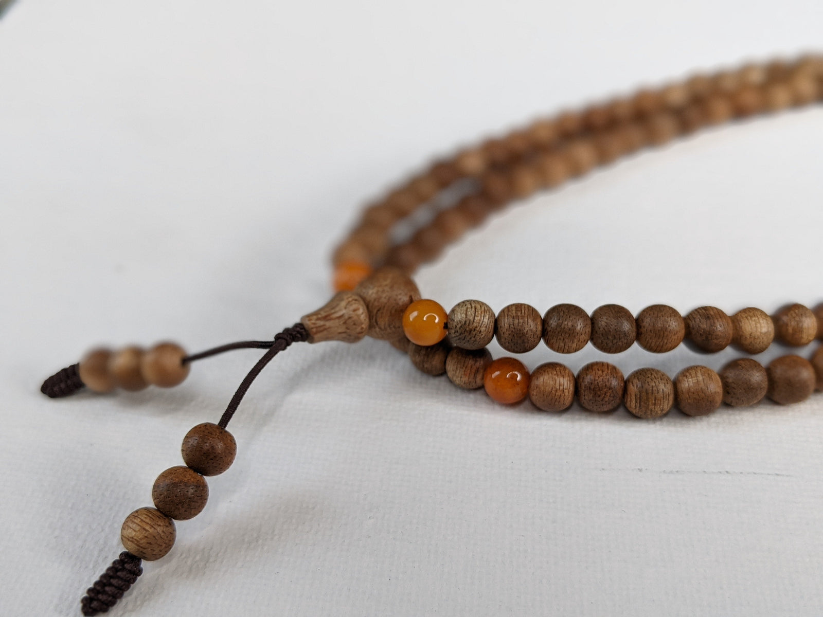 The Mood Improver - 108 Cultivated Agarwood mala with Baltic Ambers -